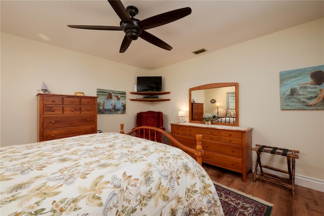 bedroom with ceiling fan and dark hardwood / wood-style flooring