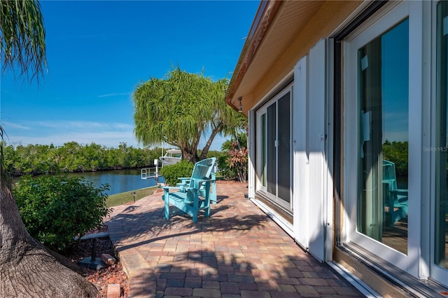 view of patio / terrace with a water view