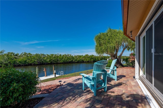 dock area featuring a patio and a water view