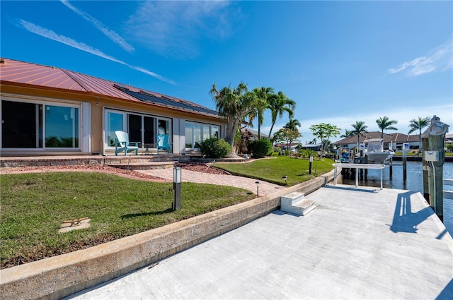 exterior space with a yard and a water view