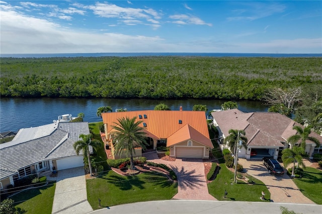 birds eye view of property with a water view