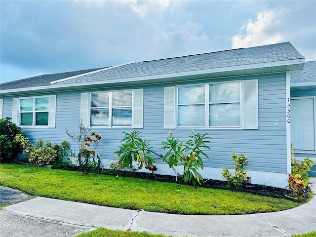 view of property exterior with a yard