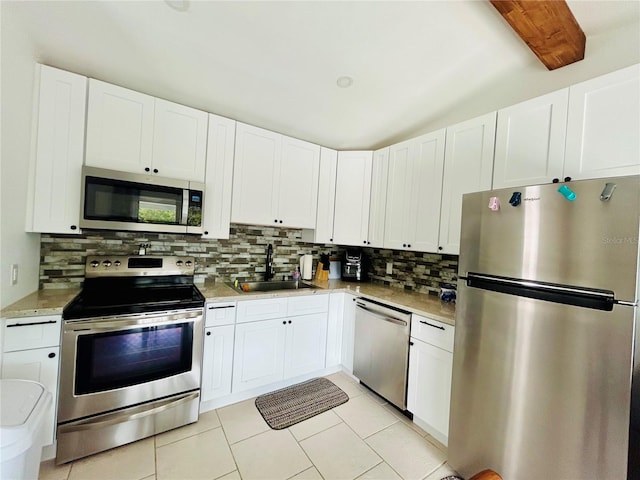 kitchen with white cabinetry, sink, and stainless steel appliances