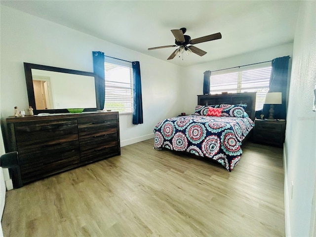 bedroom featuring ceiling fan and light hardwood / wood-style flooring