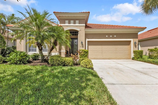 mediterranean / spanish-style house with a front yard and a garage