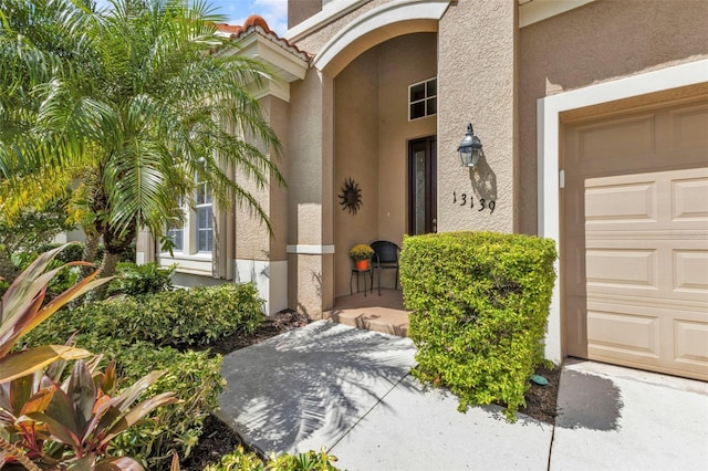 property entrance with a garage