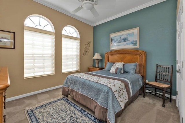 carpeted bedroom featuring ceiling fan and ornamental molding