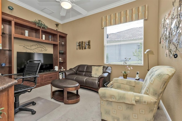 carpeted office with ceiling fan and crown molding