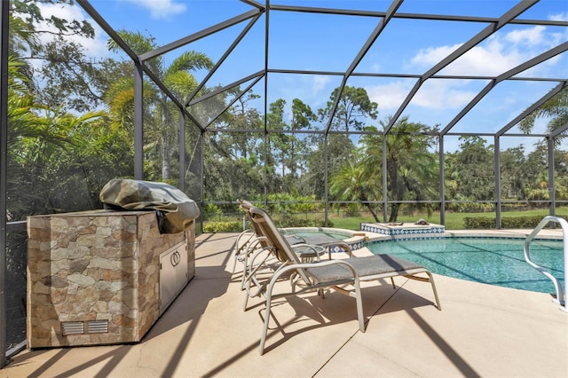 view of swimming pool featuring a lanai, grilling area, a patio, and an in ground hot tub