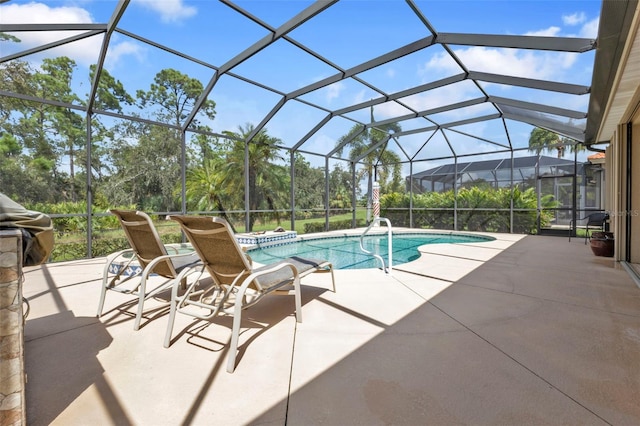 view of swimming pool with a lanai and a patio area