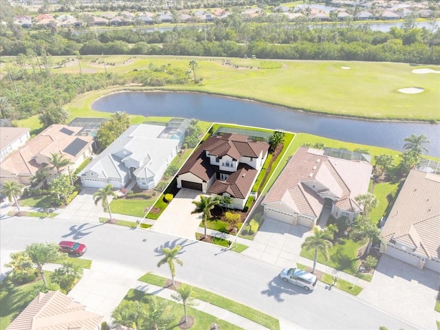 birds eye view of property featuring a water view and a residential view