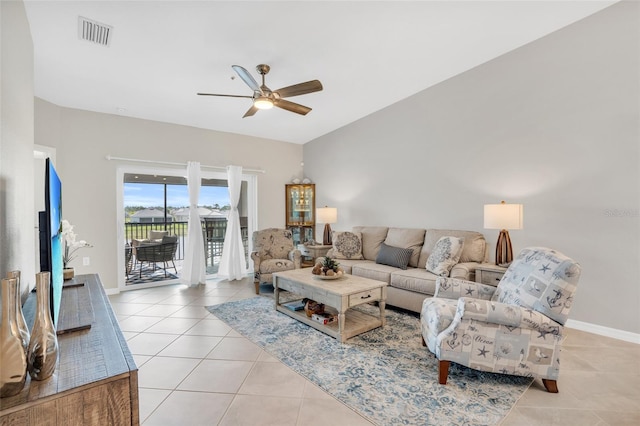 tiled living room featuring ceiling fan