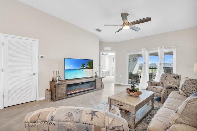 tiled living room with ceiling fan