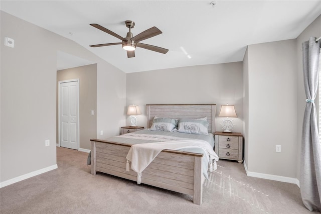 carpeted bedroom with a closet and ceiling fan