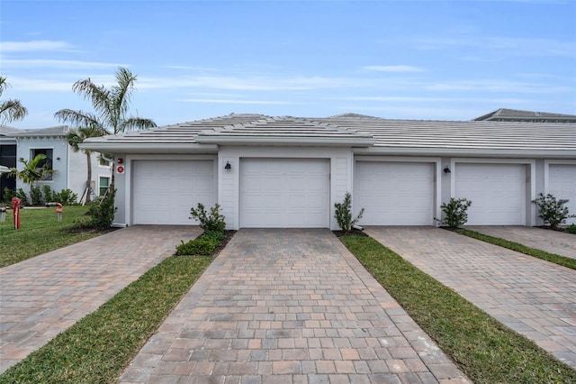 ranch-style home featuring a garage