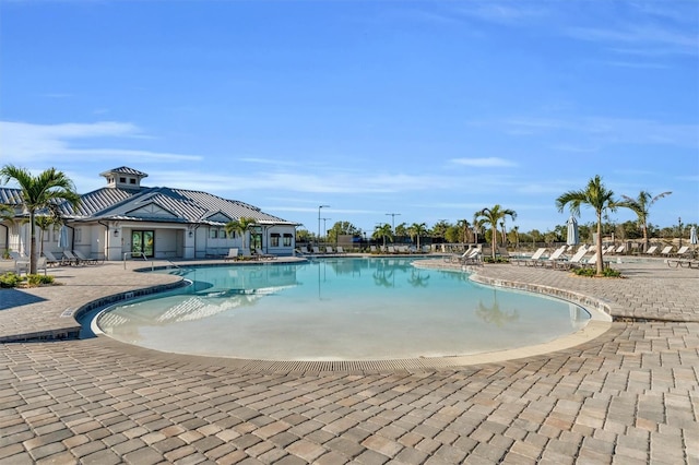 view of swimming pool with a patio area