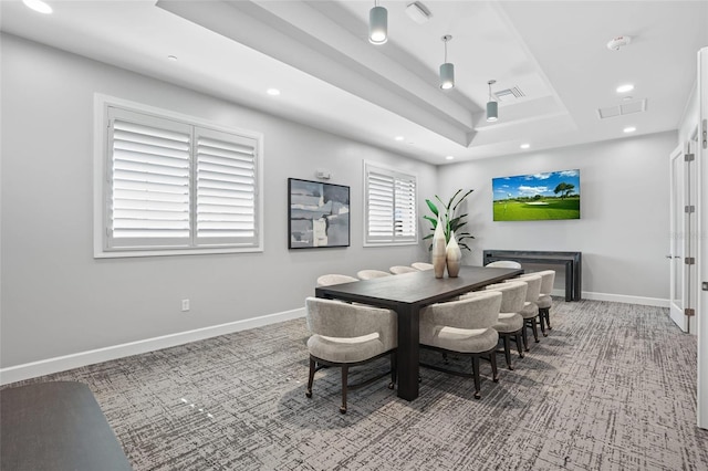 dining area with baseboards, visible vents, a raised ceiling, carpet floors, and recessed lighting