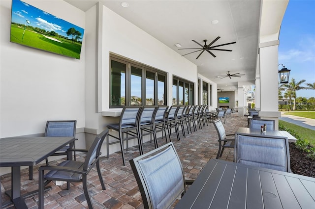 view of patio / terrace with ceiling fan and outdoor dining space