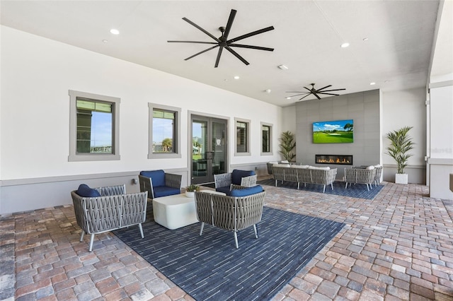 view of patio with ceiling fan and outdoor lounge area