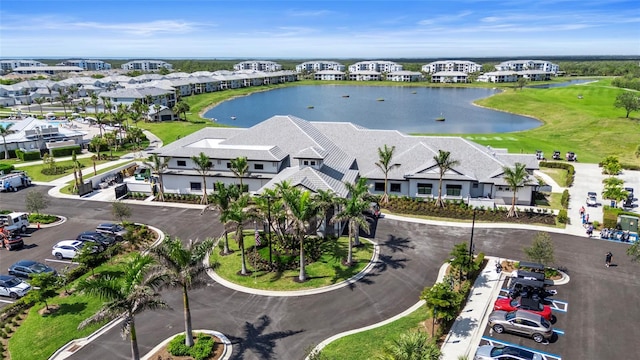 aerial view with a water view and a residential view