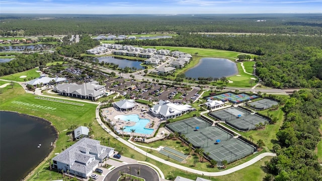 bird's eye view with a water view and a wooded view