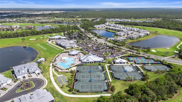 aerial view with a residential view, view of golf course, and a water view