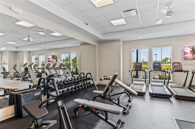 workout area featuring a drop ceiling and ceiling fan