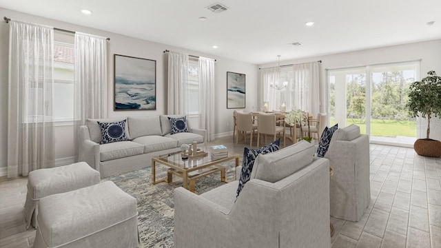 living room with an inviting chandelier