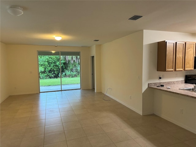 tiled empty room with sink