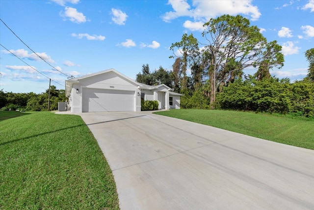 ranch-style house with a garage, cooling unit, and a front lawn