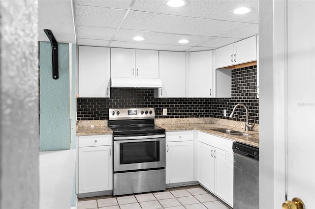 kitchen featuring white cabinetry, light stone counters, appliances with stainless steel finishes, and sink