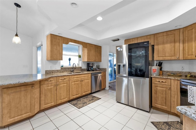 kitchen featuring sink, stainless steel appliances, light stone counters, pendant lighting, and light tile patterned floors