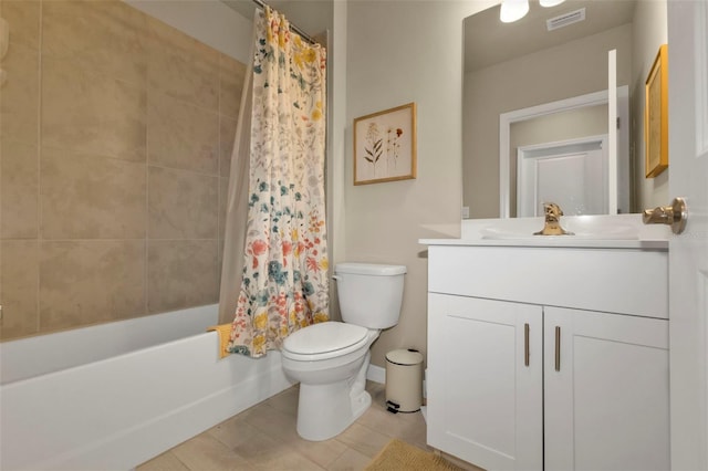 full bathroom featuring shower / bath combo, vanity, and toilet