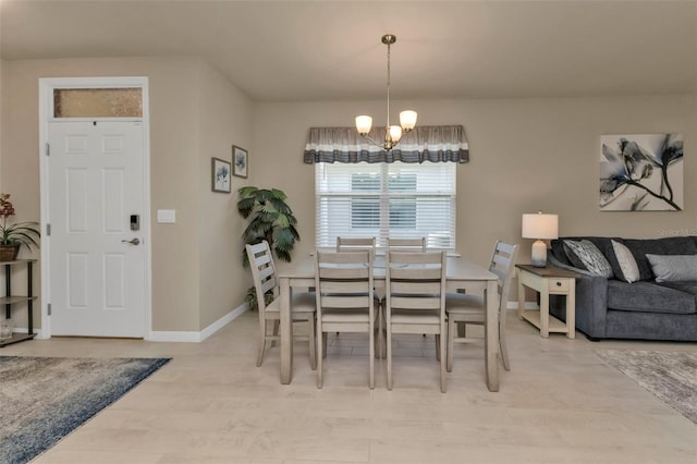 dining space featuring an inviting chandelier