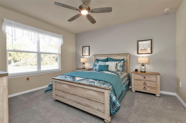 bedroom with ceiling fan and carpet