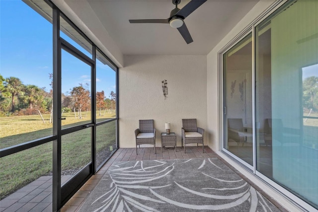 sunroom / solarium with ceiling fan