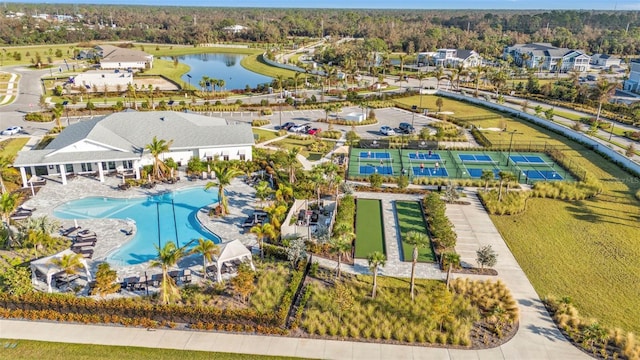 birds eye view of property with a water view