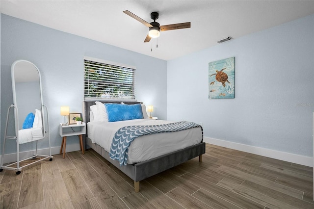 bedroom featuring ceiling fan and hardwood / wood-style flooring