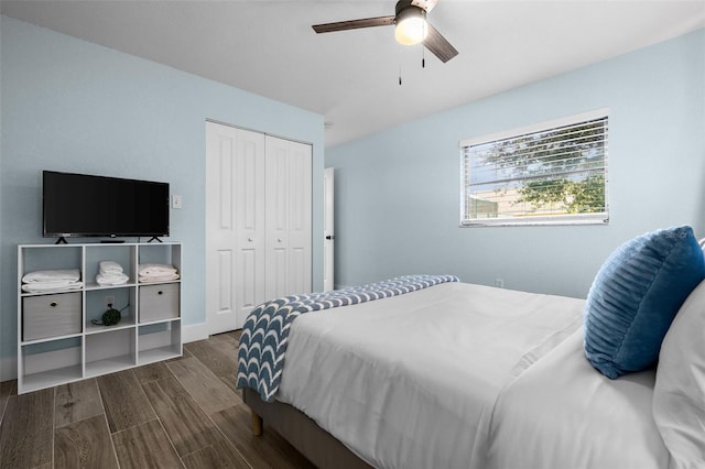 bedroom with ceiling fan, a closet, and dark wood-type flooring