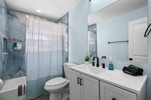 full bathroom with shower / bath combination with curtain, a textured ceiling, vanity, and toilet