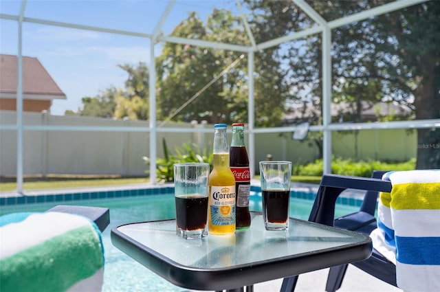 view of pool featuring a lanai