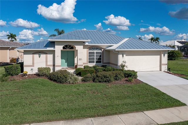 view of front facade featuring a front yard and a garage