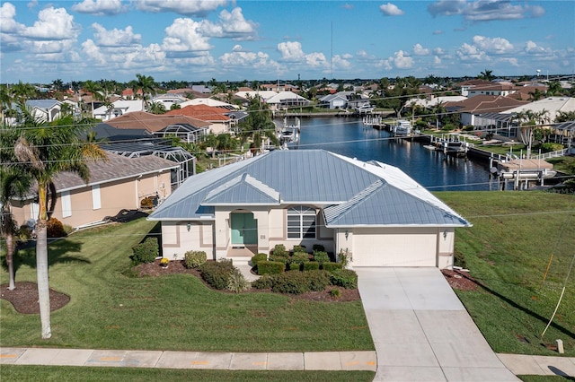 birds eye view of property with a water view