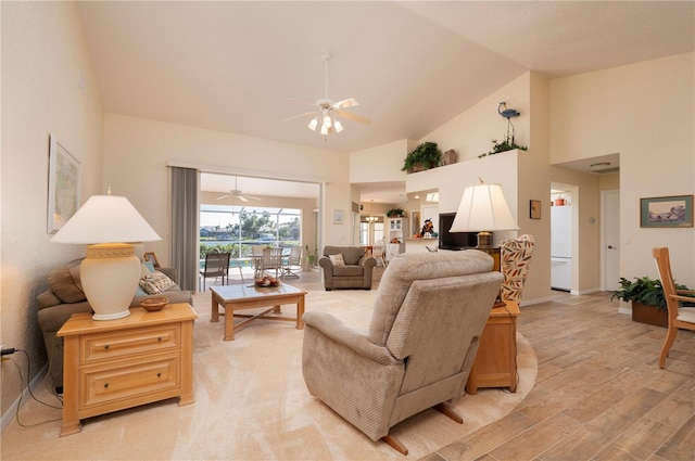 living room featuring light hardwood / wood-style flooring, high vaulted ceiling, and ceiling fan