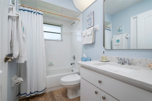 full bathroom featuring toilet, hardwood / wood-style floors, vanity, and shower / bath combination with curtain