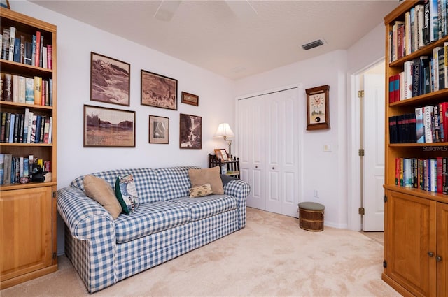 living area featuring light colored carpet