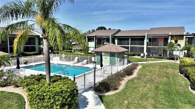 view of pool featuring a yard