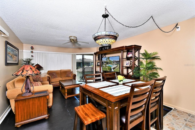 dining space featuring a textured ceiling and ceiling fan