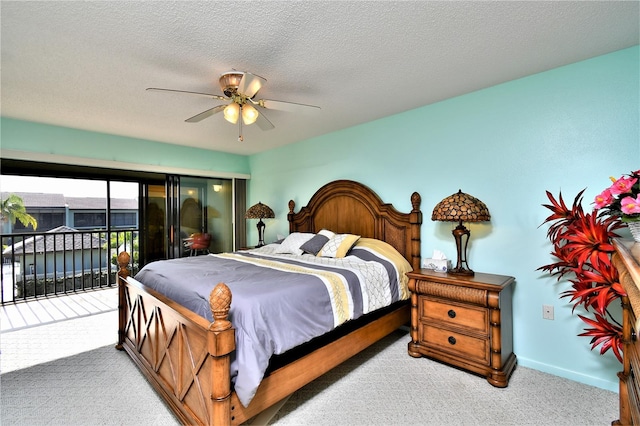 bedroom featuring carpet, a textured ceiling, access to outside, and ceiling fan