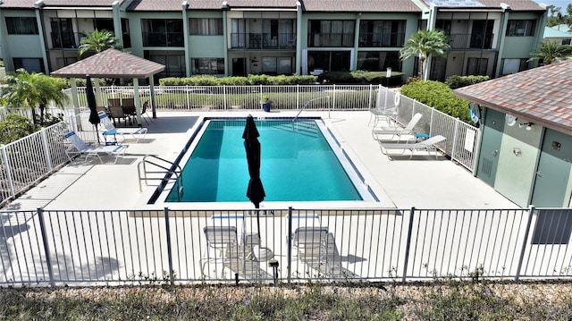 view of pool featuring a patio